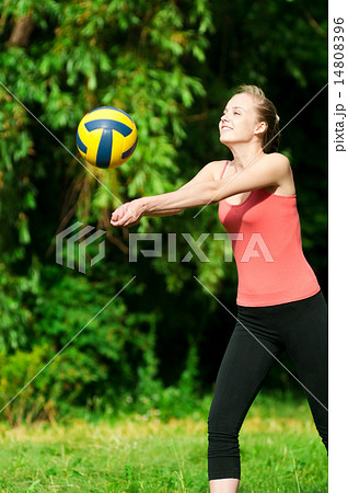 beautiful woman playing volleyball 14808396
