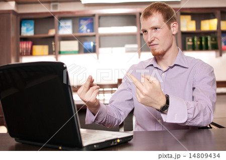 Emotional businessman with laptop Emotional businessman with laptop 14809434