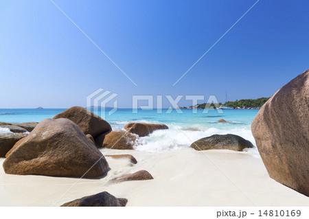 White coral beach sand and azure indian ocean. 14810169