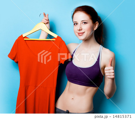 Woman showing her abs with red dress Woman showing her abs with red dress 14815371