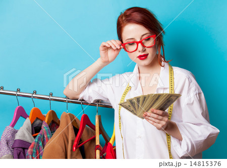 Young redhead designer with dollars Young redhead designer with dollars 14815376