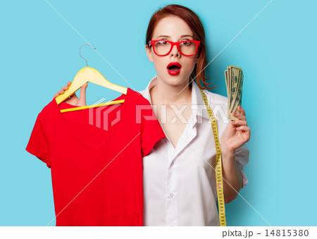 Surprised young redhead designer with dress and dollars Surprised young redhead designer with dress and dollars 14815380
