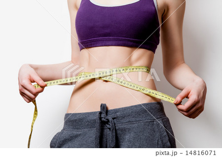 Woman showing her abs with metric 14816071