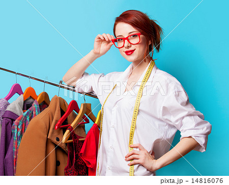 Young redhead designer with metric and clothes 14816076