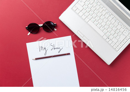 Sunglasses and paper near notebook 14816456