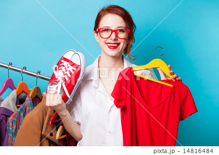 designer with red dress and gumshoes 14816484
