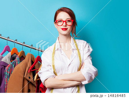 Young redhead designer with metric and clothes Young redhead designer with metric and clothes 14816485