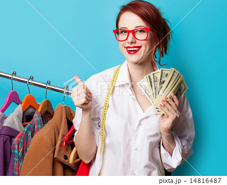 Young redhead designer with dollars Young redhead designer with dollars 14816487