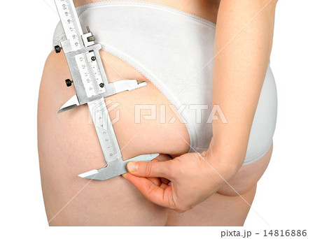 Fat woman measuring fat on the thigh caliper Fat woman measuring fat on the thigh caliper 14816886