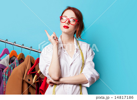 Young redhead designer with metric and clothes 14817186