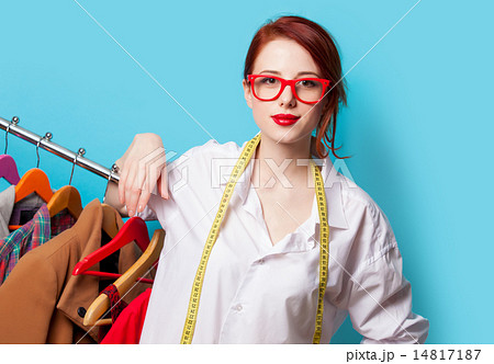 Young redhead designer with metric and clothes 14817187