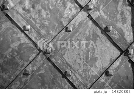 Part of an old iron gate with rivets 14820802