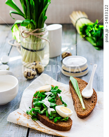 bread with wild garlic, sour cream and quail eggs 14833122