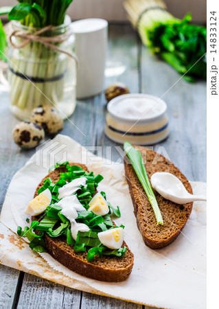 bread with wild garlic, sour cream and quail eggs 14833124
