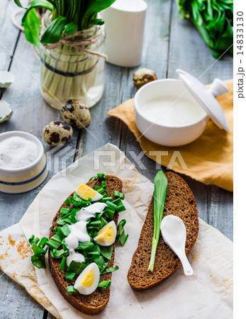 bread with wild garlic, sour cream and quail eggs 14833130
