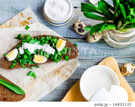 bread with wild garlic, sour cream and quail eggs 14833135