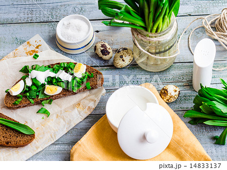 bread with wild garlic, sour cream and quail eggs 14833137