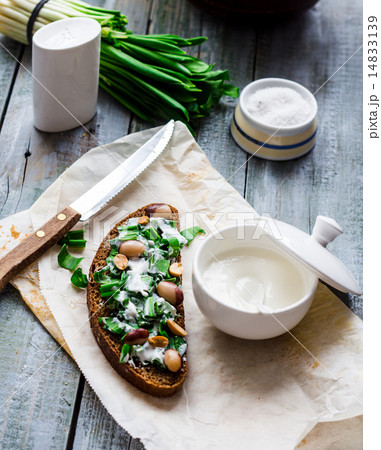 bread with wild garlic, sour cream and quail eggs 14833139