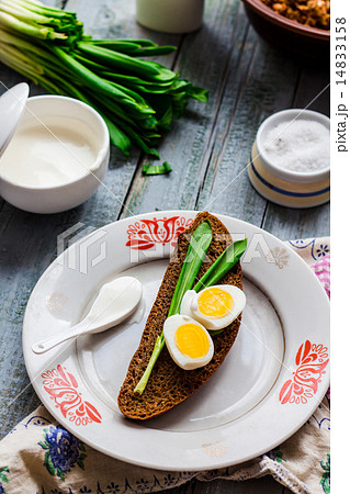 bread with wild garlic, sour cream and quail eggs 14833158