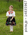 Little girl playing on a meadow 14835967