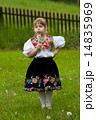 Folk costumes little girl on the meadow 14835969