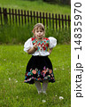 Folk costumes little girl on the meadow 14835970