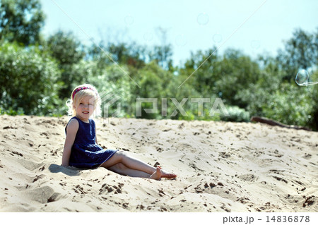 Beautiful blonde girl resting on beach 14836878