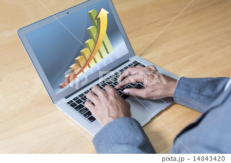Businessman typing using laptop 14843420