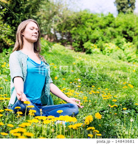 Pretty woman meditate in the park Pretty woman meditate in the park 14843681