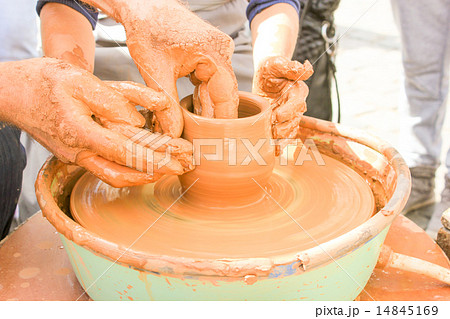 Hands working on pottery wheel. Hands working on pottery wheel. 14845169
