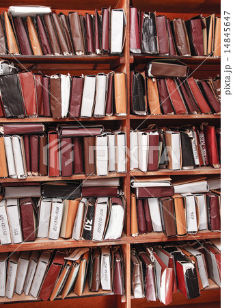 Paper documents stacked in archive 14845647