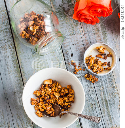 granola with nuts and dried fruits, flowers 14848194