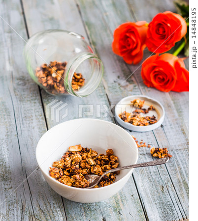 granola with nuts and dried fruits, flowers 14848195