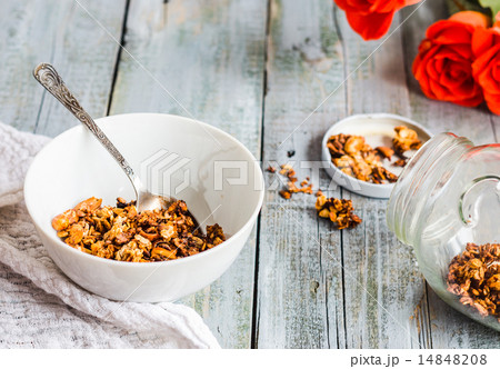 granola with nuts and dried fruits, flowers 14848208