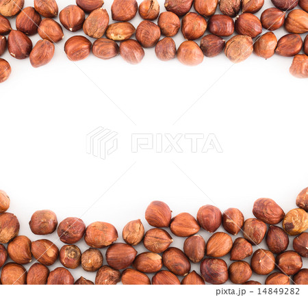 Hazelnuts over white surface background 14849282