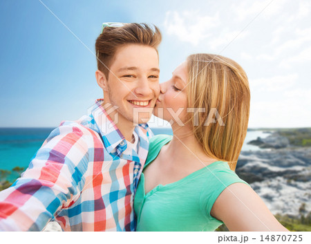 happy couple taking selfie on summer beach happy couple taking selfie on summer beach 14870725
