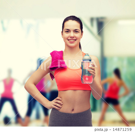 sporty woman with towel and water bottle 14871259