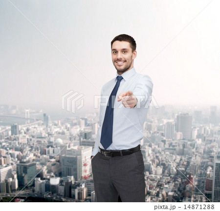 handsome businessman pointing finger at you handsome businessman pointing finger at you 14871288