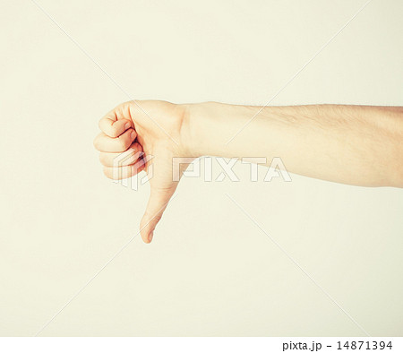 man showing thumbs down man showing thumbs down 14871394