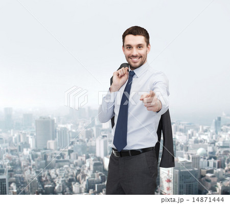 handsome buisnessman with jacket over shoulder handsome buisnessman with jacket over shoulder 14871444