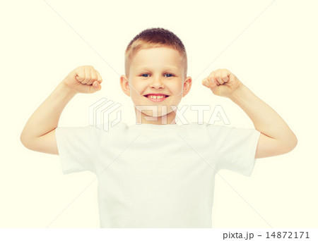 little boy in blank white t-shirt showing muscles 14872171