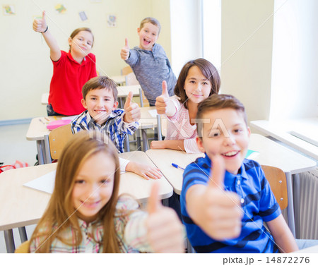 group of school kids showing thumbs up group of school kids showing thumbs up 14872276