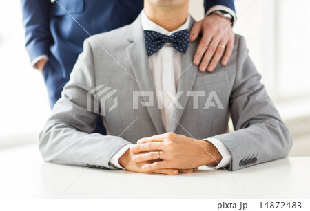 close up of male gay couple with wedding rings on 14872483