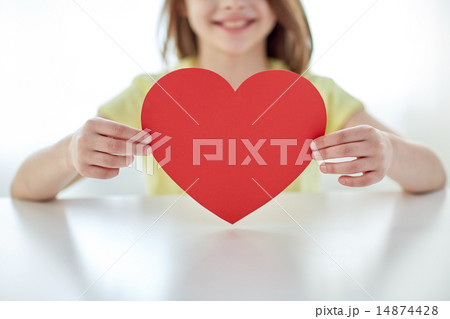 close up of child hands holding red heart close up of child hands holding red heart 14874428