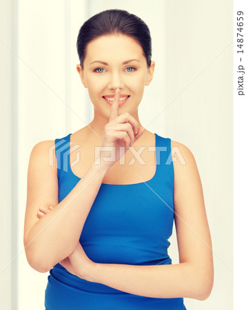 woman making a hush gesture woman making a hush gesture 14874659