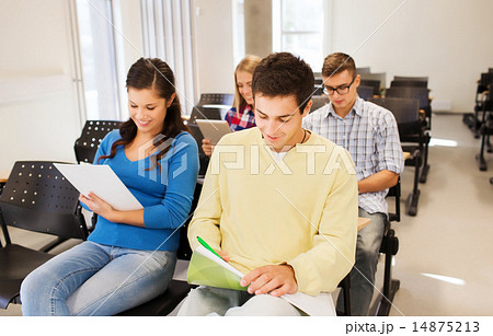 group of smiling students in lecture hall 14875213