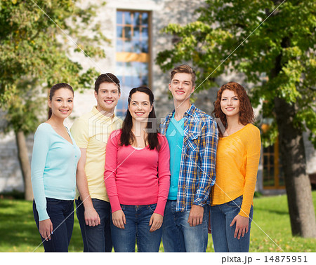 group of smiling teenagers over campus background 14875951