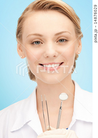 happy young female dentist with tools 14876029
