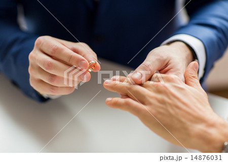 close up of male gay couple hands and wedding ring 14876031