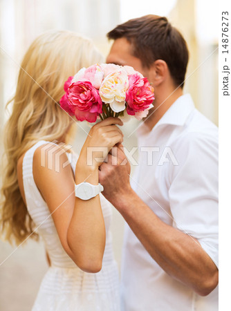 couple with flowers in the city couple with flowers in the city 14876273